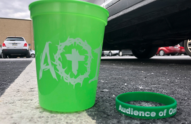 green cup and rubber wristband