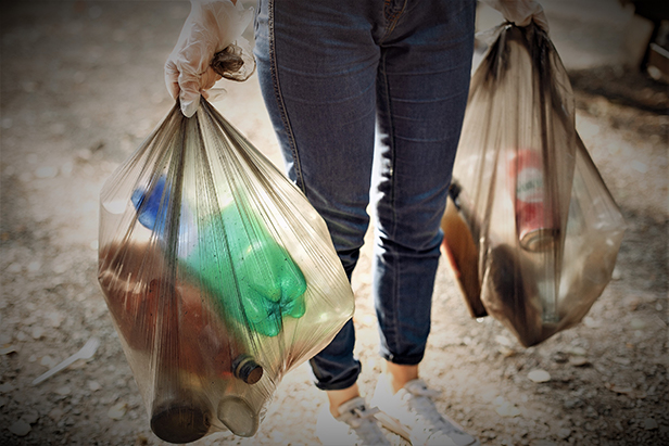 Person holding plastic bags