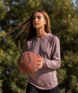Young Woman Playing Basketball