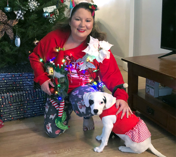 woman with dog wearing red dress