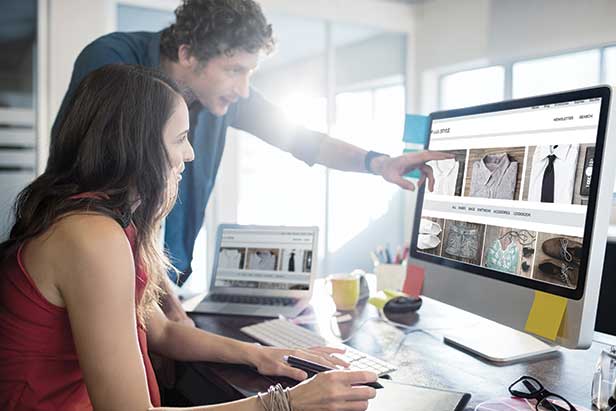 Young man and woman looking at an e-commerce site