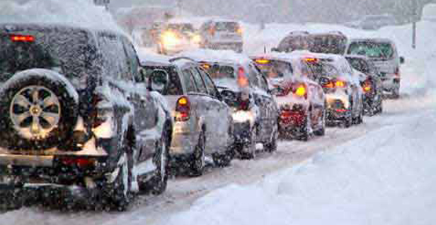 Line of cars in snow storm