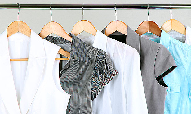 Women's apparel hanging on rack.