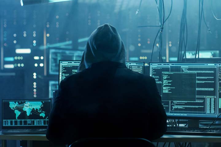 Hooded cybersecurity criminal