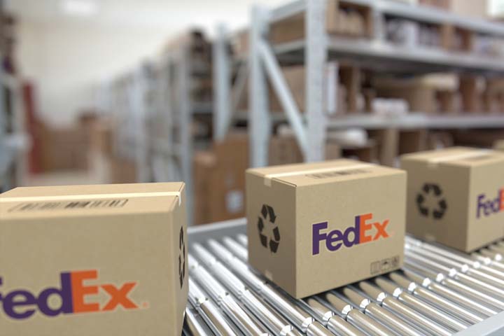 FedEx boxes on conveyor belt