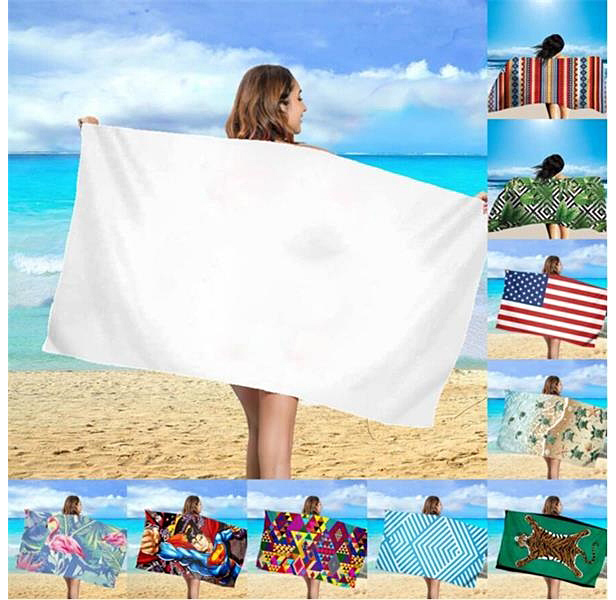 woman holding beach towel