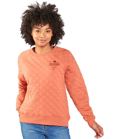 woman wearing orange waffle pullover