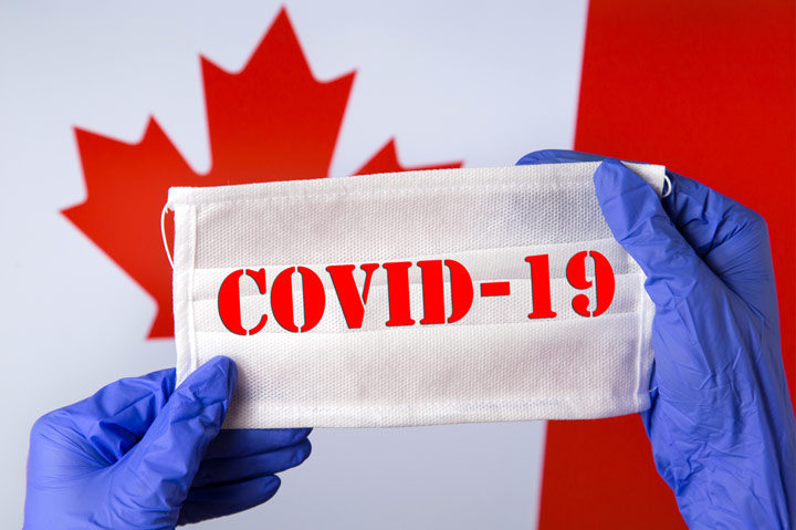 Covid-19 on mask and Canadian flag