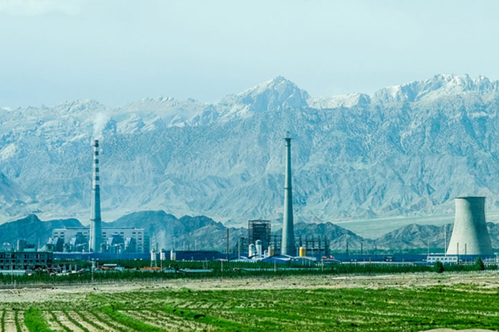 power plant set against mountain range