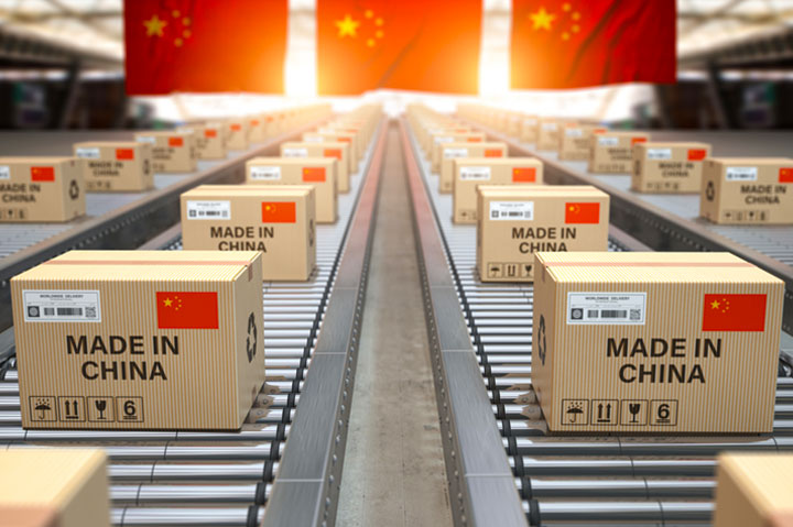 Made In China boxes on conveyor belt, Chinese flag in background