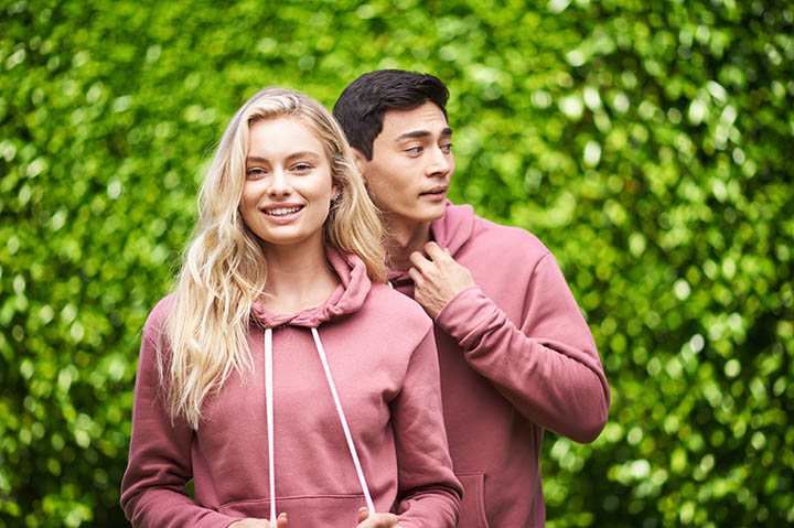 Young couple in mauve sweaters