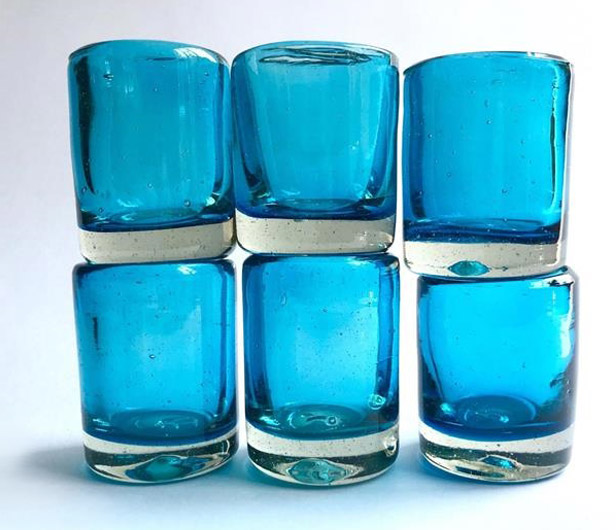 blue shot glasses stacked two rows high