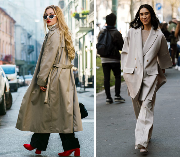 two women wearing oversized neutral-colored trench coats