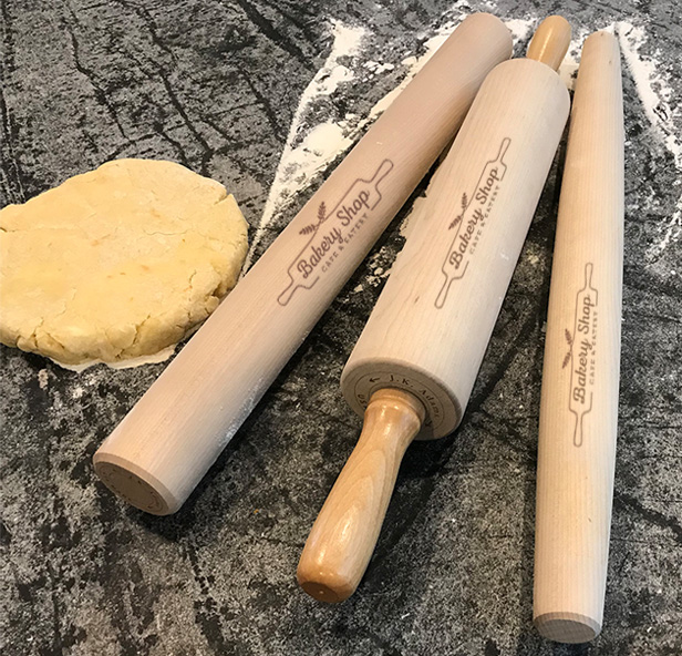 three rolling pins and pie dough