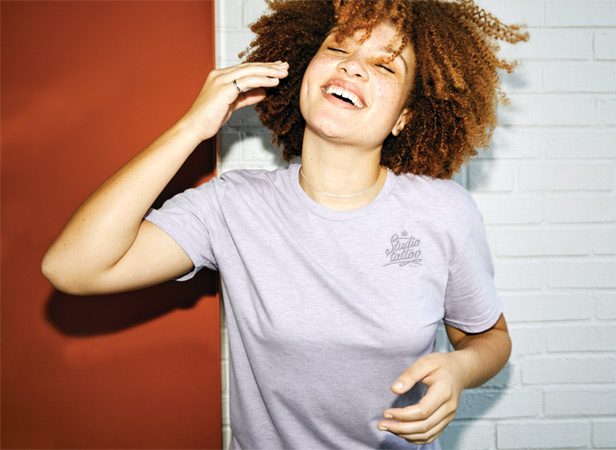 woman smiling wearing Hanes t-shirt