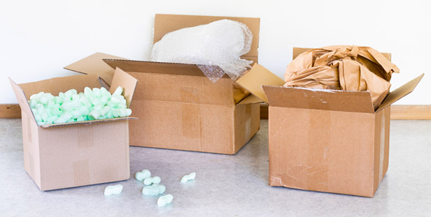 three boxes with packing material