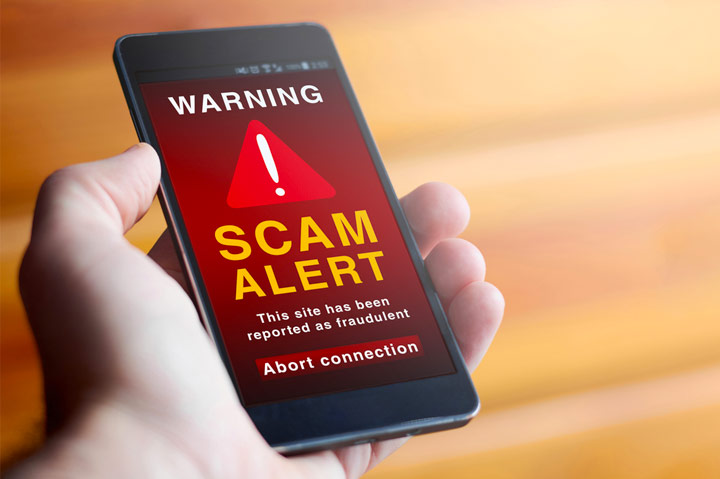 scam alert warning displayed on smart phone