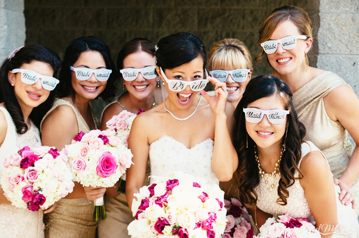 bride and bridesmaids wearing logoed sunglasses