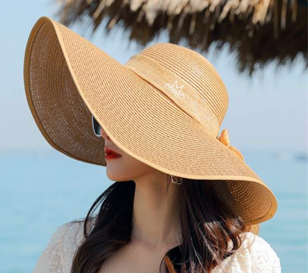 woman wearing wide-brimmed straw hat