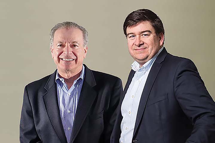 Vantage owner and President Ira Neaman, shown here with John Lynch, in a photo taken to commemorate the melding of their respective businesses – Vantage being the top apparel decorator in the U.S. and Lynka being the top apparel decorator in Europe – when Vantage acquired the majority share of Lynka last July.