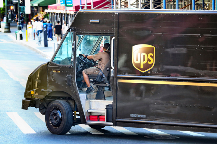 UPS truck turning corner on city street