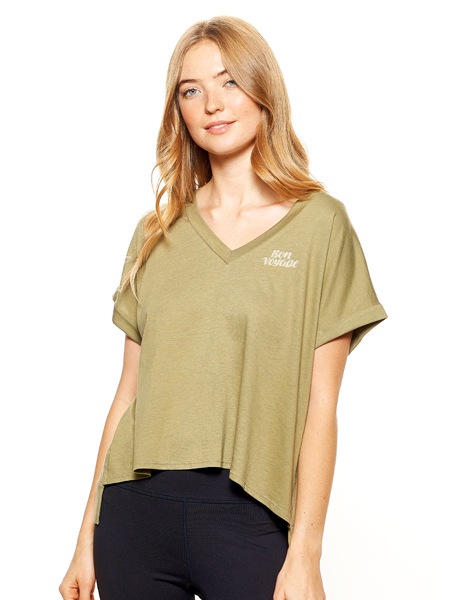 Woman wearing oversized green v-neck t-shirt