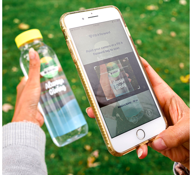 Fill It Forward water bottle, smart phone and app in foreground