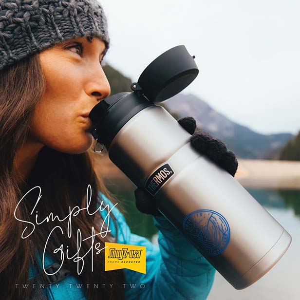 Young woman drinking from a Thermos