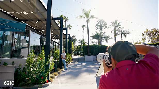 Photographer taking picture of a model wearing fashionable apparel