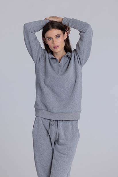 Young woman in heather-gray sweatpants
