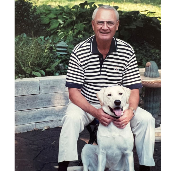 David Lage with yellow lab dog