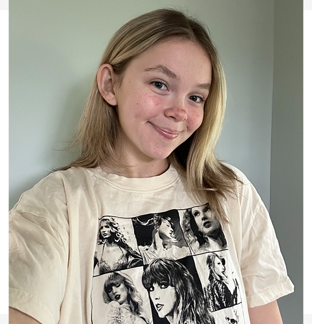 young blonde girl wearing Taylor Swift t-shirt