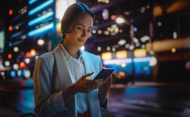 Woman walking with smartphone