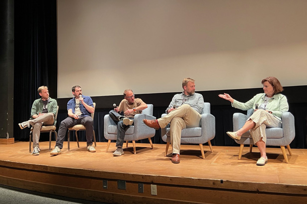 panel of speakers on stage
