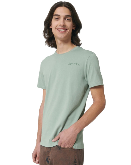 young man wearing light green t-shirt, smiling