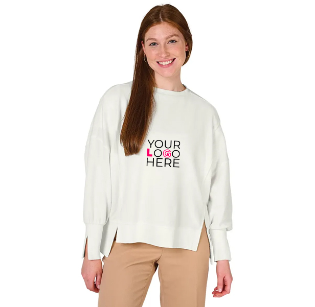 young woman smiling in white sweatshirt