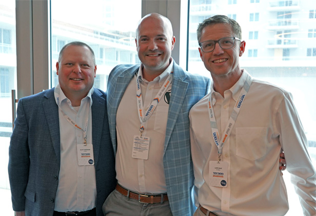 three men smiling