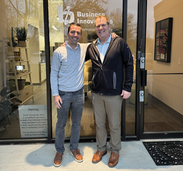 Brandability partnership, two men in front of building