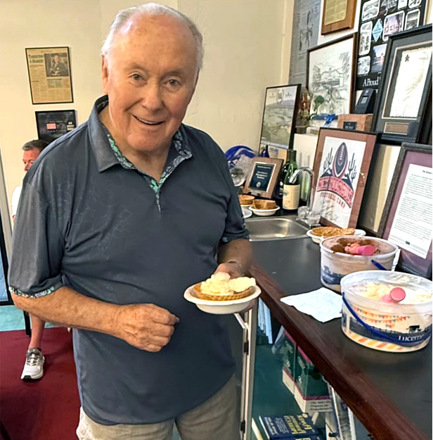 employee attends an ice cream sundae bar