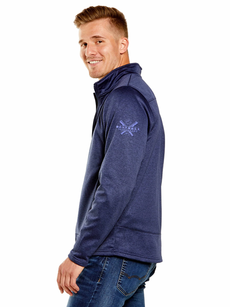 man wearing dark blue zip up, smiling