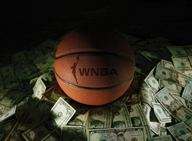 WNBA basketball on pile of cash